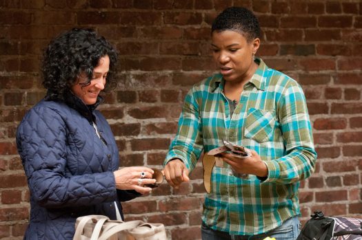 Debbie Mukamal, left, looks over some of the leather bracelets designed by June Lee.